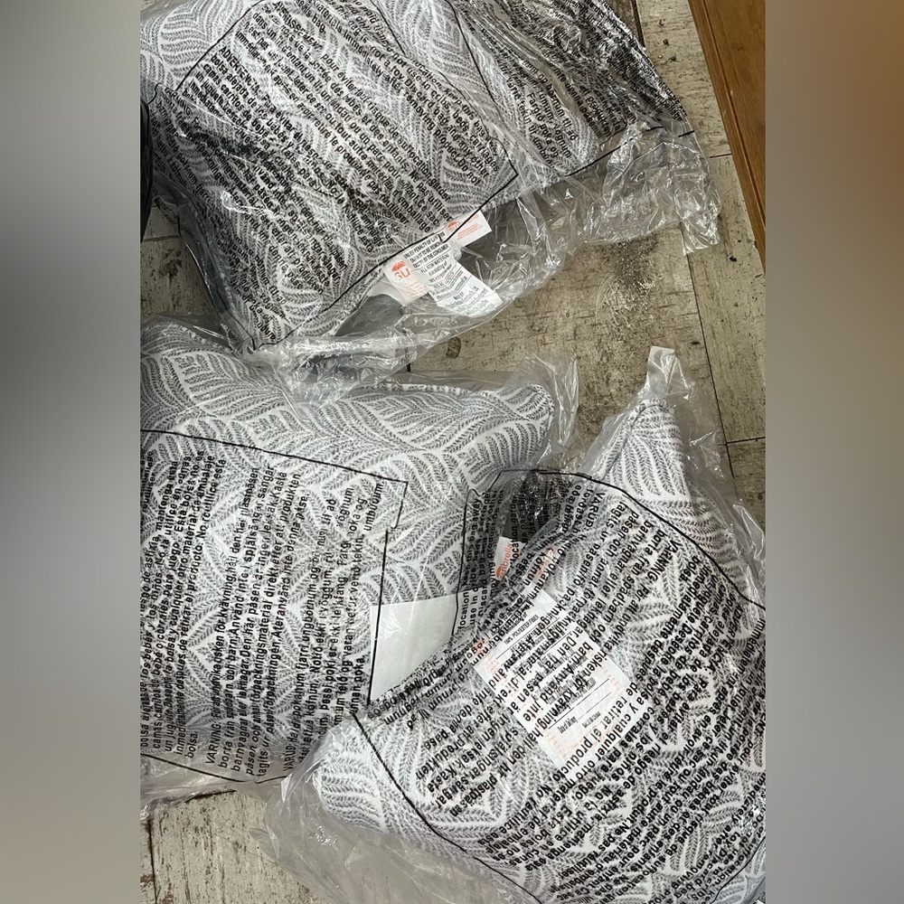 Three brand new Sunbrella pillows in package